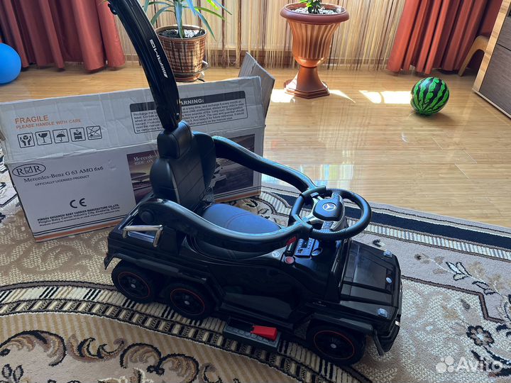 Машинка-каталка электрическая