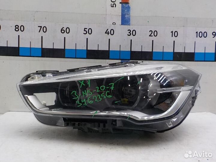 Фара левая BMW X1