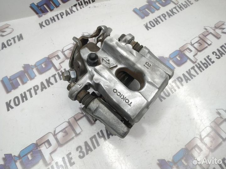 Суппорт задний левый Toyota Corolla 150