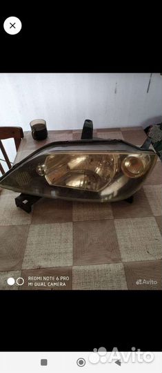 Фара Mazda Demio L
