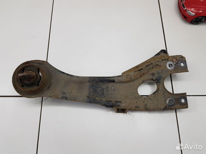 Рычаг продольный задний левый