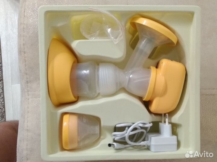 Молокоотсос medela электрический