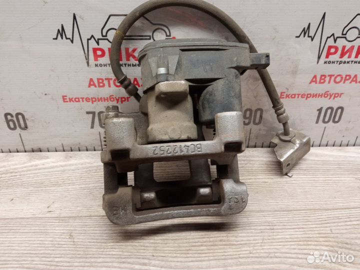 Суппорт тормозной задний левый Kia Sportage QL