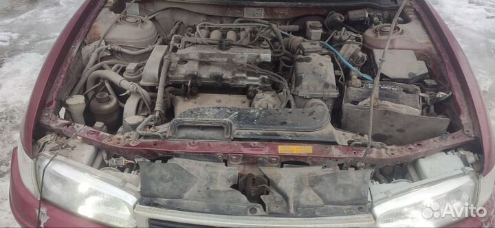 Суппорт тормозной задний Мазда 626 GE 1997