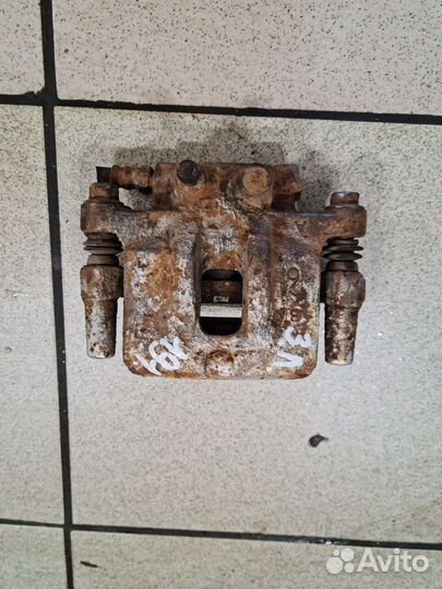 Суппорт передний задний Mitsubishi Lancer X