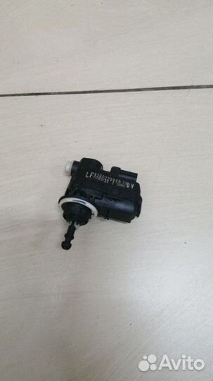 Моторчик корректора фары Nissan Almera