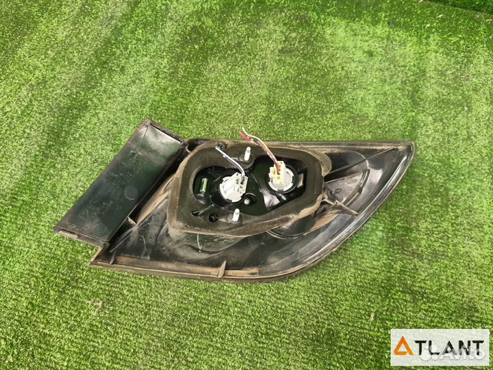 Фонарь задний левый mazda axela