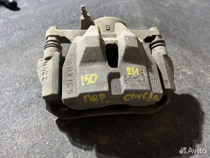 Тормозной суппорт передний Toyota Corolla 150
