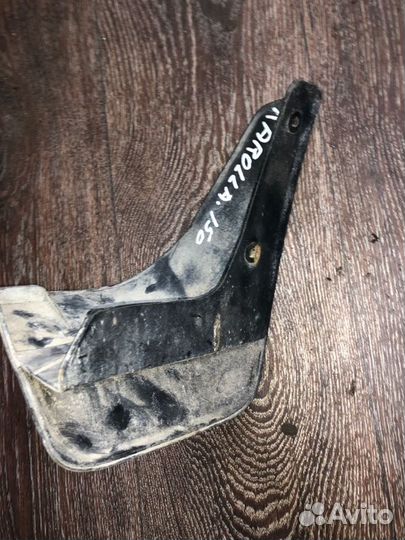 Брызговик задний левый Toyota Corolla ADE150