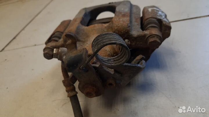 Суппорт тормозной задний левый Ford Edge