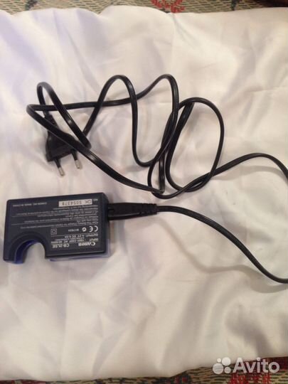 Зарядное устройство Canon (для фотоаппарата и др.)