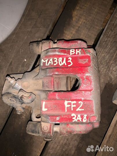 Суппорт задний левый mazda 3 bk