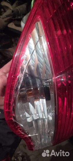 Фонарь задний внешний левый Nissan Almera G15