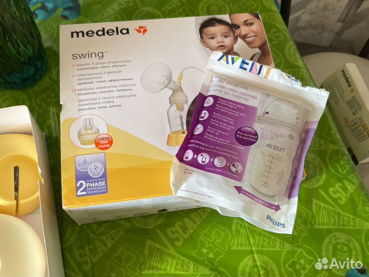 Молокоотсос medela swing