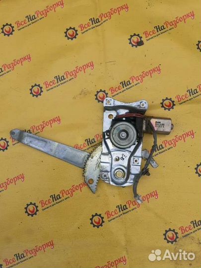 Моторчик стеклоподъемника задний правый Mazda 323