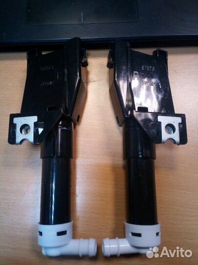 Форсунка омывателя фар Mitsubishi Pajero 4