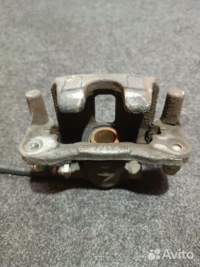 Суппорт тормозной задний левый Mitsubishi Lancer