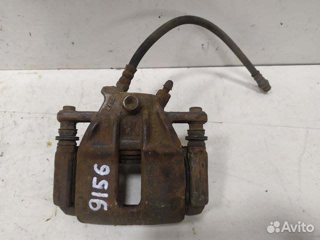 Суппорт тормозной передний левый Almera (G15) 2013