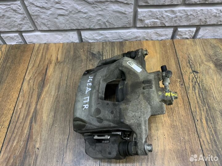 Орel Аstrа J Суппорт тормозной передний Правый