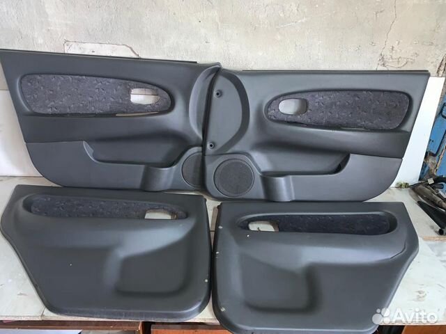 Обшивка двери Kia Spectra