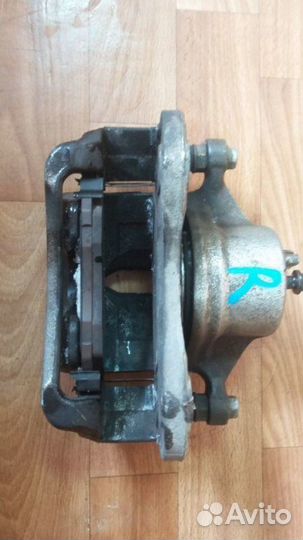 Суппорт тормозной передний правый Kia Sportage 3