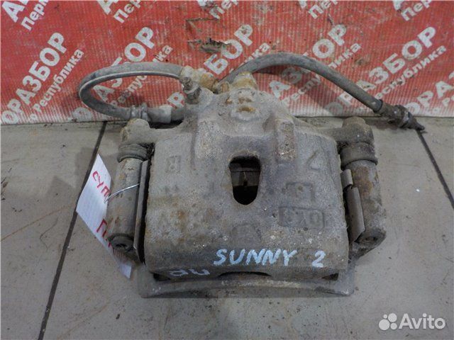 Суппорт передний правый Nissan Sunny traveller