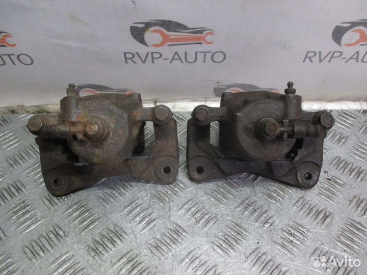 Суппорт тормозной передний Nissan Almera N15