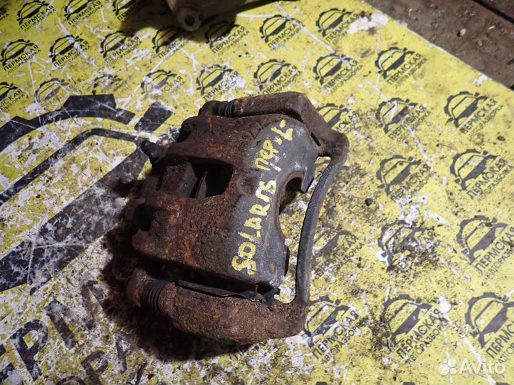 Суппорт тормозной передний левый Hyundai Solaris 1