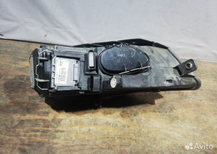 Фара передняя левая Volkswagen Passat B6