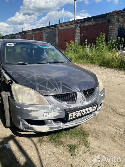 Передний бампер lancer 9