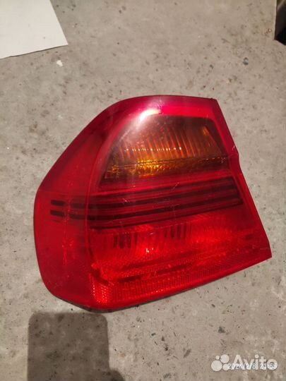 Фонарь задний левый BMW e90