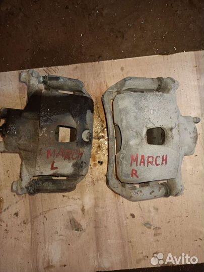 Суппорт тормозной Nissan March K12