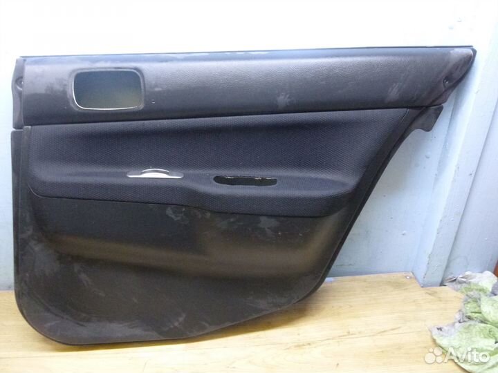 Обшивка двери задней правой Lancer Cedia