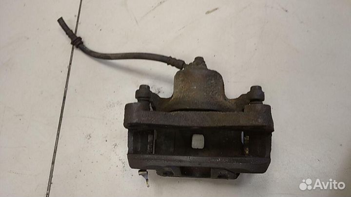 Суппорт передний левый Nissan Teana