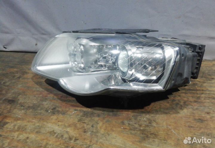 Фара передняя левая Volkswagen Passat B6