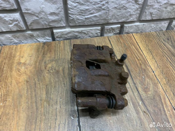 Mitsubishi Lancer 10 Суппорт тормозной задний