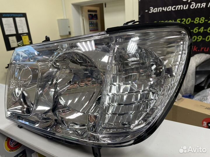 Фара левая Toyota Land Cruiser 100 212-11H9L-LD-EM