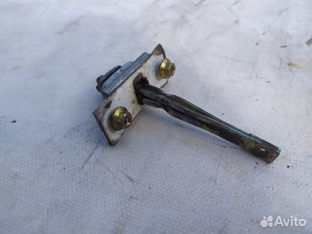 Ограничитель двери передний левый Mazda Demio 1.3