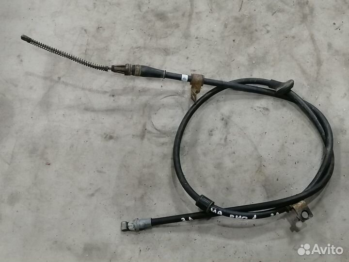Трос стояночного тормоза левый Kia RIO 2000-2005