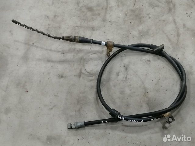 Трос стояночного тормоза левый Kia RIO 2000-2005