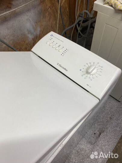 Электролюкс с вертикальной заг. стиральная машина