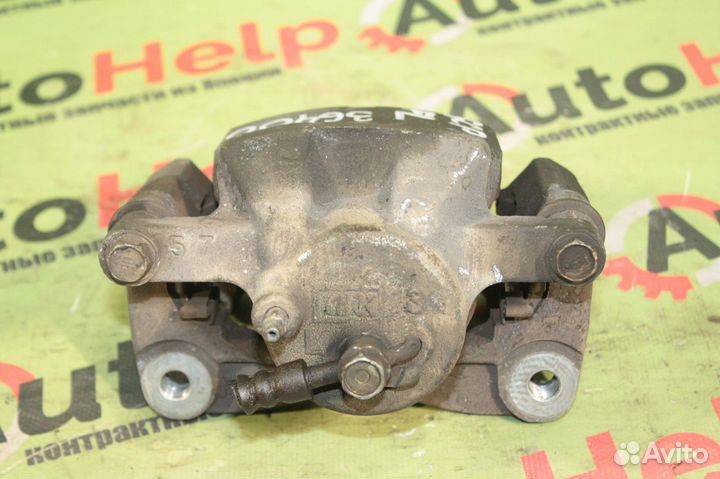 Суппорт toyota ractis SCP100 2SZ-FE 22VL перед лев