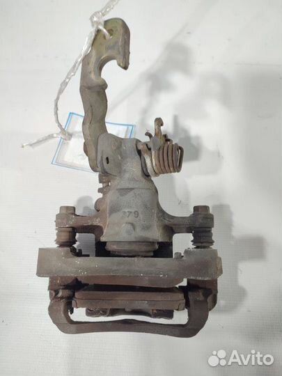 Суппорт задний левый Nissan Primera TP12 QR20DE