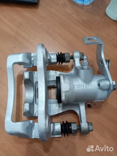 Суппорт тормозной задний kia rio 3,Солярис