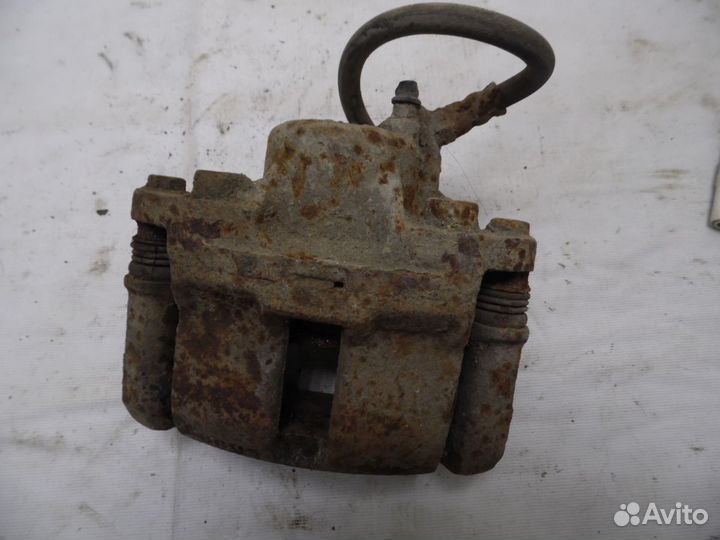 Суппорт тормозной передний левый Renault Logan 1 2