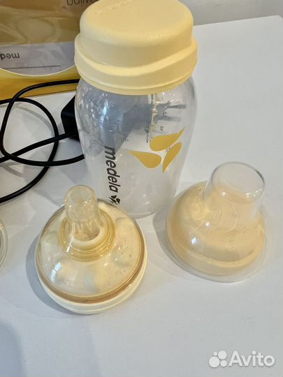 Молокоотсос medela электрический
