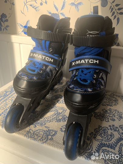 Роликовые коньки