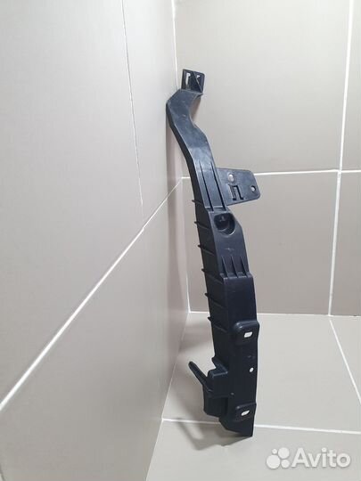 Кронштейн переднего бампера левый Opel Astra J