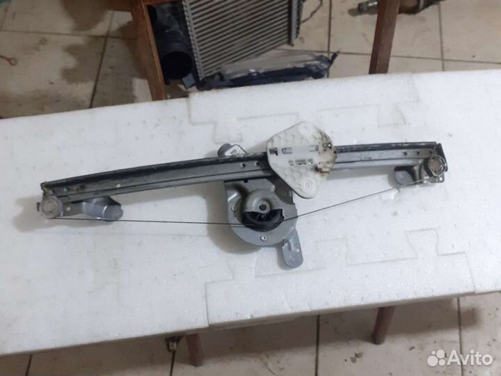 Стеклоподьемник передний левый Logan 1