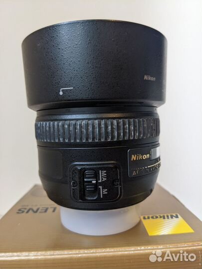 Объектив Nikon 50mm и рюкзак-слинг и чехол